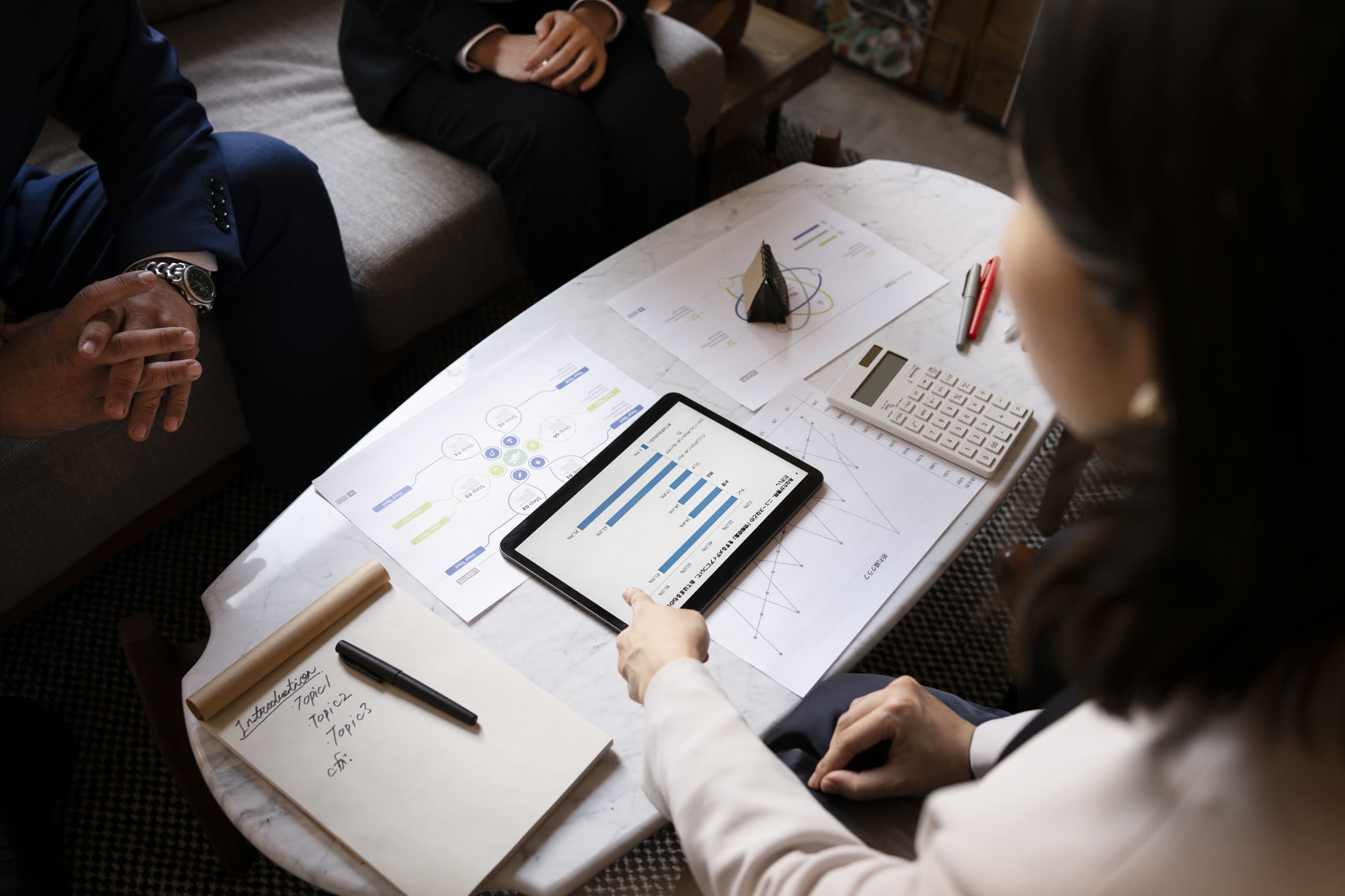 Consulting team reviewing performance data
